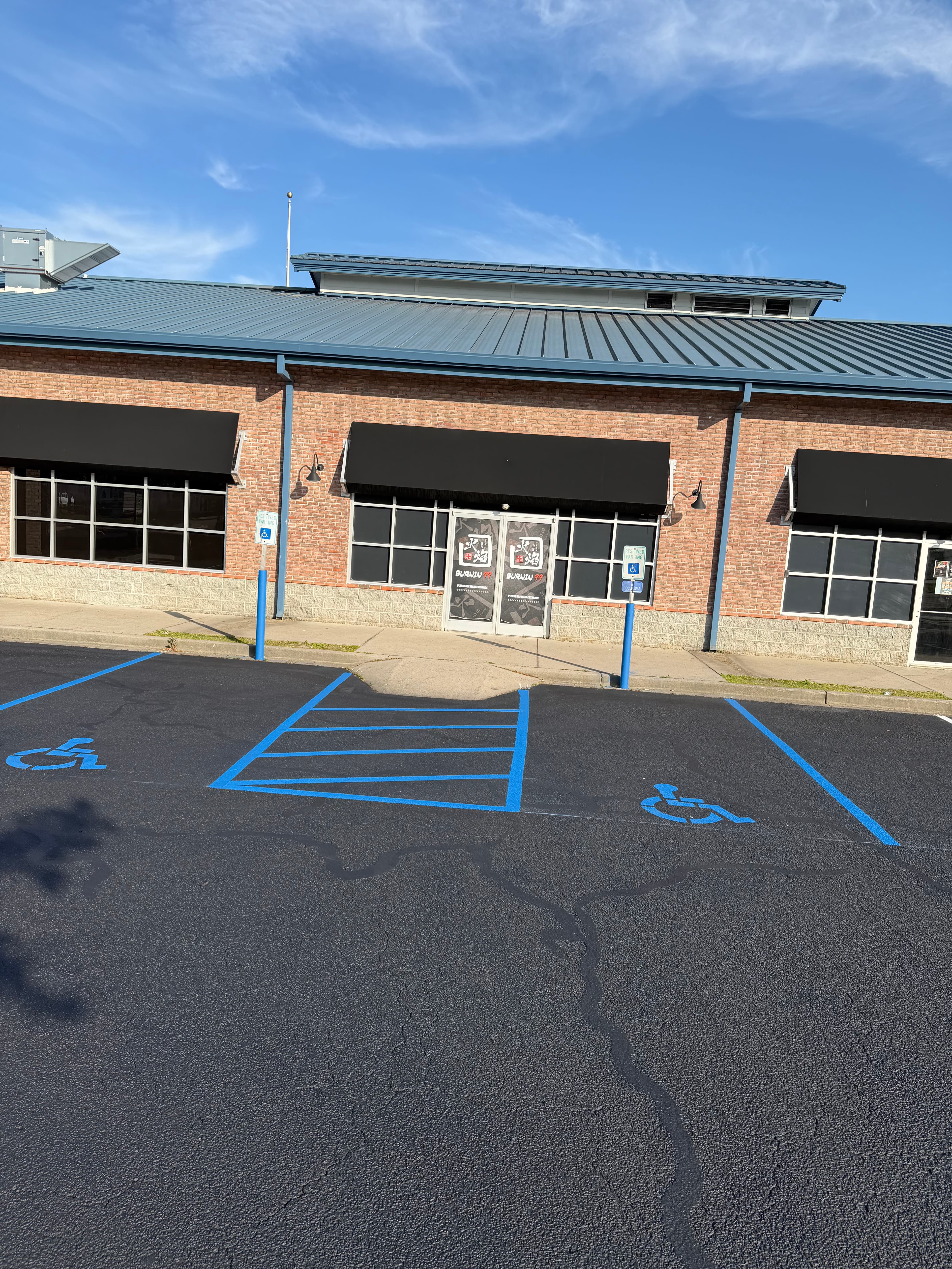 Project Shopping Center Parking Lot Gets Full Crack Fill, Seal, and Stripe image