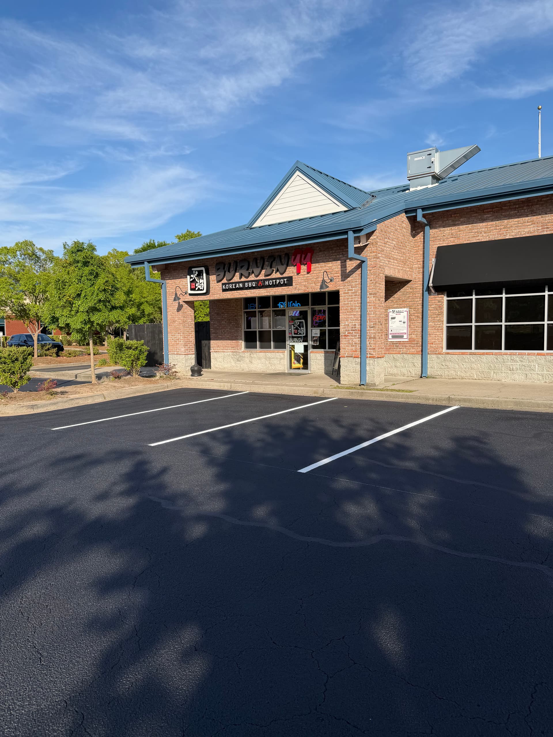 Gallery photos for Shopping Center Parking Lot Gets Full Crack Fill, Seal, and Stripe: Image #2